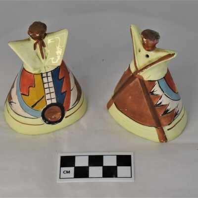 View of the backside with long wooden pole supports for the teepee