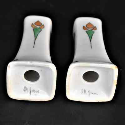 Marked "I.M. Jones" on the bottom of each shaker.