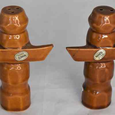 Back of Totem Pole salt and pepper shakers with labels.
