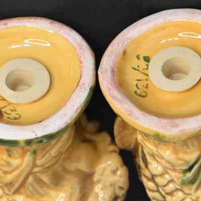 Bottoms of wheat salt and pepper shakers with original labels. Both are numbered.