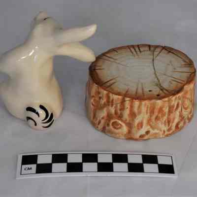 Back and size comparison of rabbit and tree stump salt and pepper shakers.