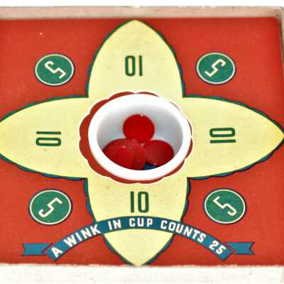 Tiddledy Winks game interior: Showing game board and glass cup placed in center