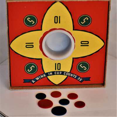 Tiddledy Winks and game pieces: Showing game board, glass cup, and remaining 7 "winks"