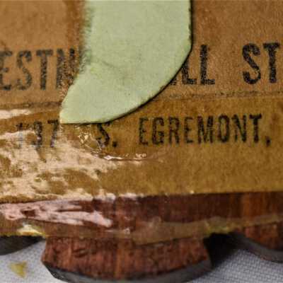 Believed to say Chestnut Hill Studio. Search results yielded nothing.