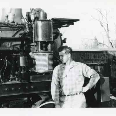 Man Next to Steam Engine