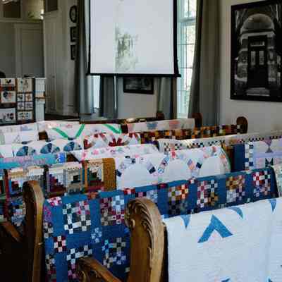 Quilt show during June 3rd event inside the Assembly Room of the City Hall / Old Methodist Church