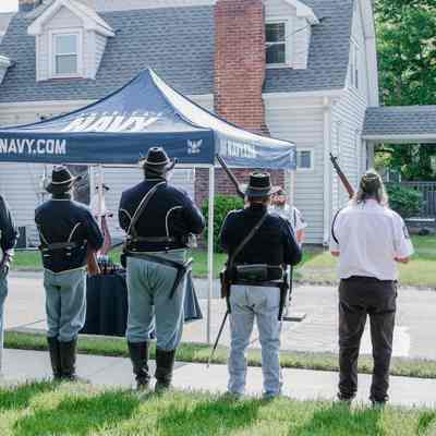 The Veterans of Foreign Wars and the American Legion detail and Civil War reenactors performing a gun salute