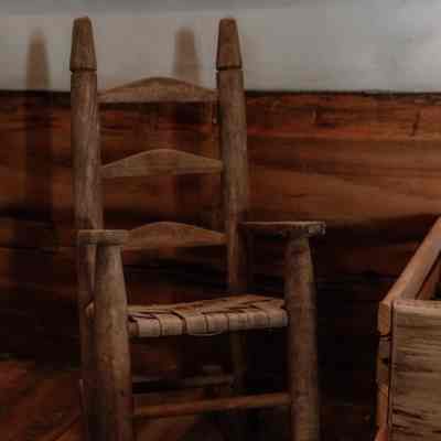 Whicker seated chair in log cabin