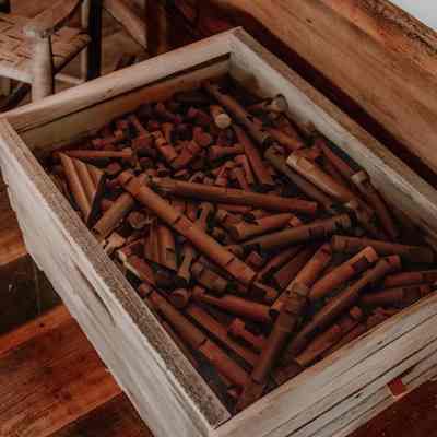 Box with wooden flutes inside log cabin