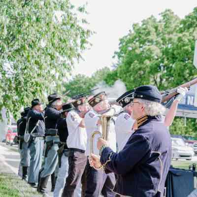 The Veterans of Foreign Wars and the American Legion detail and Civil War reenactors performing a gun salute