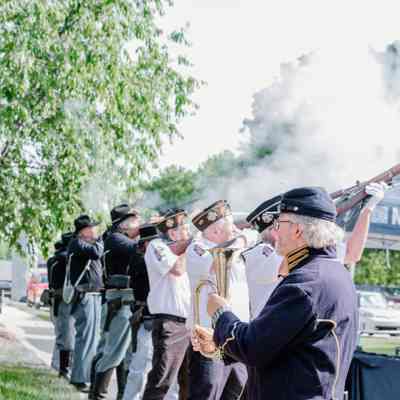 The Veterans of Foreign Wars and the American Legion detail and Civil War reenactors performing a gun salute