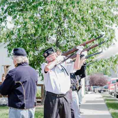 The Veterans of Foreign Wars and the American Legion detail and Civil War reenactors performing a gun salute