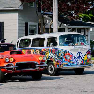 Volkswagen Bus and Corvette Sports car at car show