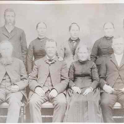 Group picture of four men and four women of the Carey, Barker, Sullivan, Steeds and Haworth families