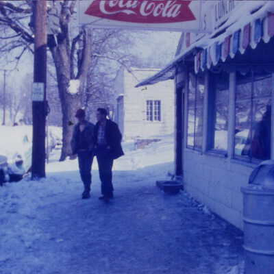 Snow Pictures Two Man walking in front of Strongs Diner on Union Street