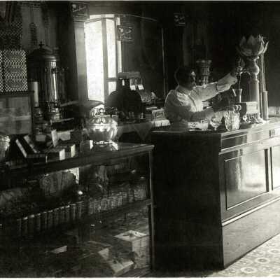 K Burroughs behind counter of Lunch Room