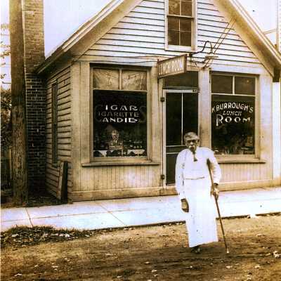 Kansas "Kemp" Burroughs in front of K Burroughs Lunch Room