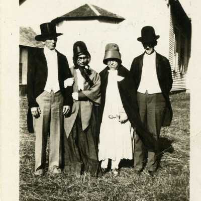 Pruitt and Reagan couples in old fashioned clothing in back of Eagletown Friends