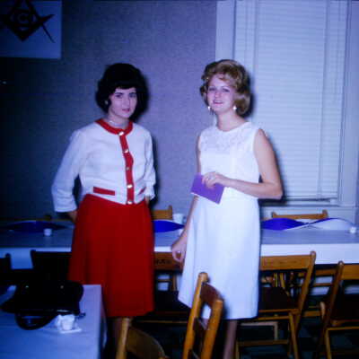 Young women inside building during an event