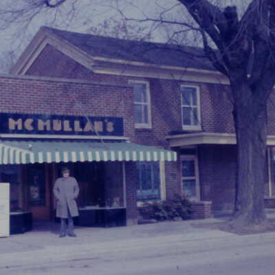 120 East Main Street McMullan's Funeral Home and Men's clothing
