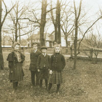 Marshall-Schmidt Album: Boys and Girls Standing Outside in Yard