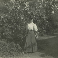 Marshall-Schmidt Album: Woman Standing Near Garden