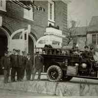 Fire Department: Firemen with Ladder and Hose Truck, c. 1922