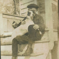 Marshall-Schmidt Album: Boy with Dog on Porch