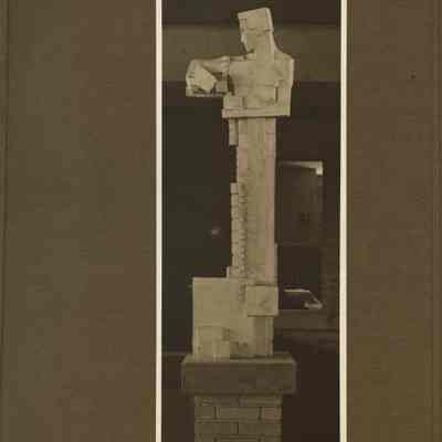 Male Sprite holding cubes sits atop a pedestal.