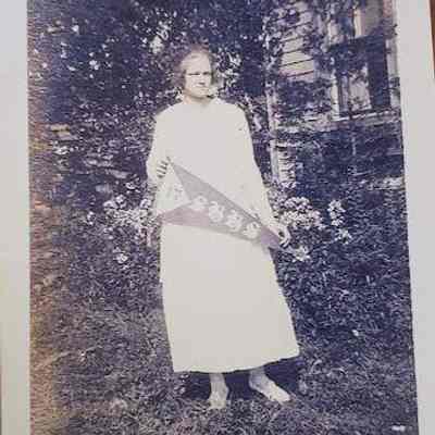 Caparn: Kathleen E. Caparn with Short Hills High School Banner