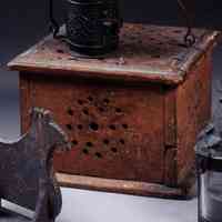          Lot number 5 from the Kahn Collection sale, part one, Northeast Auctions, August 3, 2002. Early American Red Painted and Pierced Fine Foot Warmer with Iron Coal Tray
   