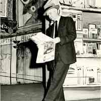          Tom Ahearne played Lt. Brannigan. Here he catches up on news in Guys and Dolls, 1955.; Original Photo by Karter Hopkins.
   