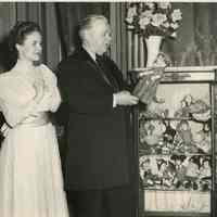          Patricia Peardon and Gene Lockhardt look over the doll collection in The Music Master, November 22-December 11, 1955.
   