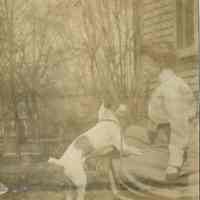 Snow: Woman Kneeling with Dog