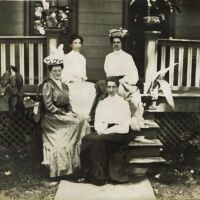 Marshall-Schmidt Album: Elizabeth Schmidt-Marshall and 3 Women Seated on Porch Steps