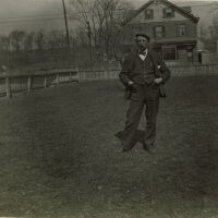 Marshall-Schmidt Album: Frank Marshall Standing in Yard