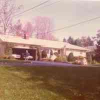          Elizabeth and Elmer Thomas III, October 1975. Newly painted house. 1973 Lincoln and 1969 Chev. in garage.
   
