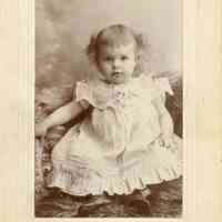 Bosworth: Unidentified girl on fur carpet, c. 1900