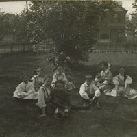 Marshall-Schmidt Album: Margaret Marshall and Children Seated on Lawn