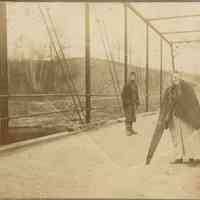 Bosworth: Mysterious Photo of Woman with Enormous Saw on a Bridge