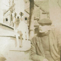          Marshall-Schmidt Album: Frank Marshall Seated on Porch Steps with Dog picture number 1
   