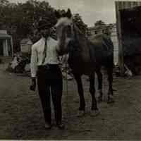 Marshall-Schmidt Album: African American Man Leading a Horse