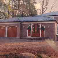 Fire Department: Photograph of house with garage doors similar to a fire station