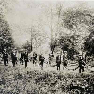 Semi-Centennial Celebration: young Boys on Parade with Fire Hose Reel, 1907