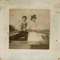 Unidentified Photograph: Man and Woman in a Boat Holding Oars