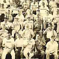          Photograph of members of the Homely Men's Club of Millburn's 5th Annual Outing at Doerr's Grove on August 2, 1941 showing members of the club drinking beer out of glass mugs
   