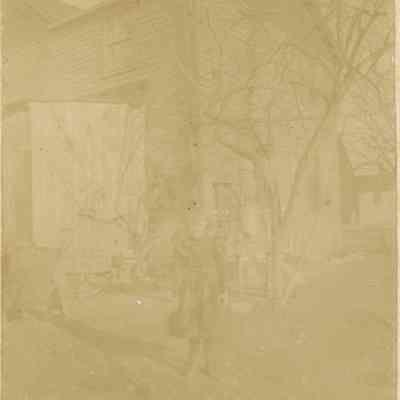 Gallitelli: Girl Standing in front of 9 Orchard Street, Millburn