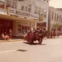          Antique Car popping a wheelie in front of the Millburn Cinema.
   