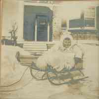 Bosworth: Unidentified Child in Sled Outside House