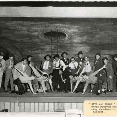 Warde Donovan and the crap shooters in the hideout in Guys and Dolls, 1955.: Photo by Drew B. Peters Studios.